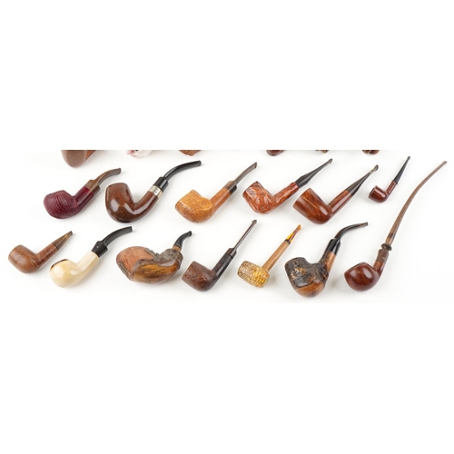 1284 - Twenty vintage tobacco smoking pipes, some briar examples, including figural and animal carved bowls... 