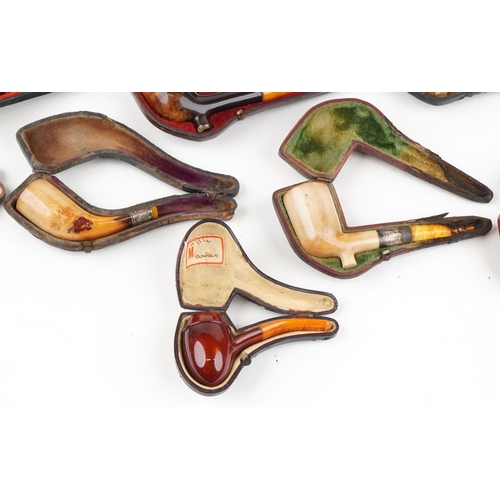 1286 - Fifteen Meerschaum tobacco smoking pipes with cases, some with amber colour mouthpieces and silver m... 