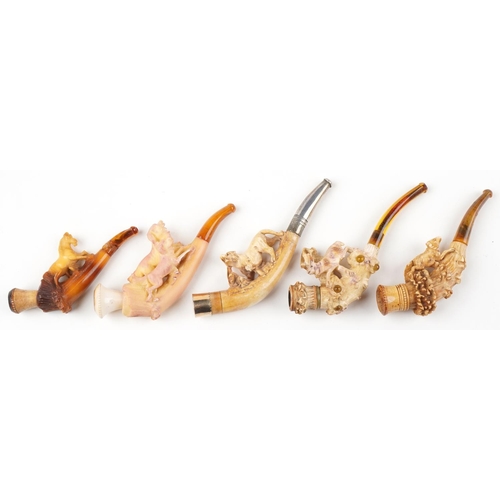 1253 - Five antique Meerschaum smoking pipes housed in fitted cases, each carved with animals, four with am... 