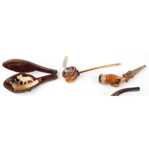 1252 - Six antique Meerschaum smoking pipes including three carved with hands, one carved with a wild anima... 