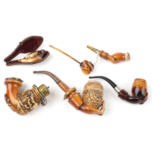 1252 - Six antique Meerschaum smoking pipes including three carved with hands, one carved with a wild anima... 