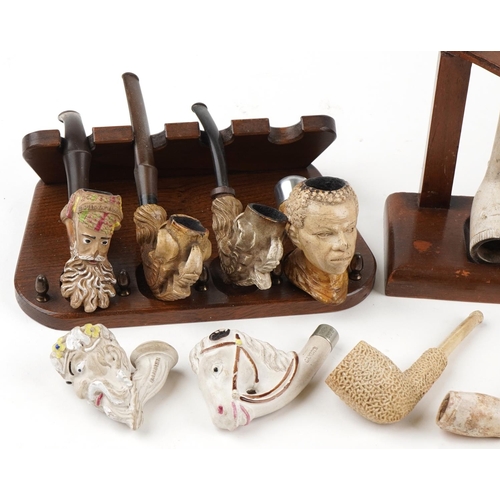 1288 - Antique and later tobacco smoking pipes, predominantly clay and block meerschaum, some arranged in f... 