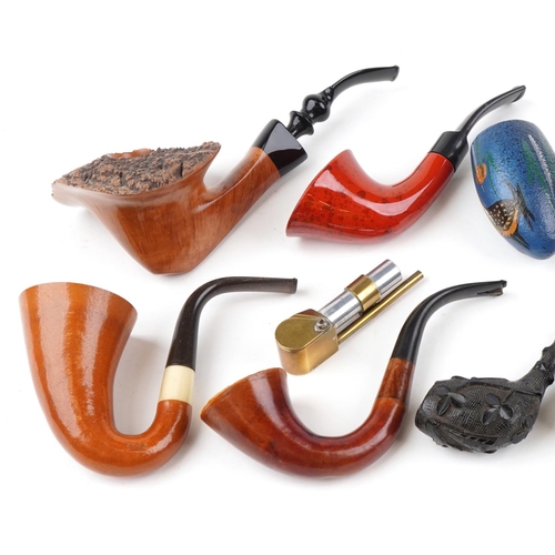 1312 - Sixteen antique and later tobacco smoking pipes including a good quality example carved in the form ... 