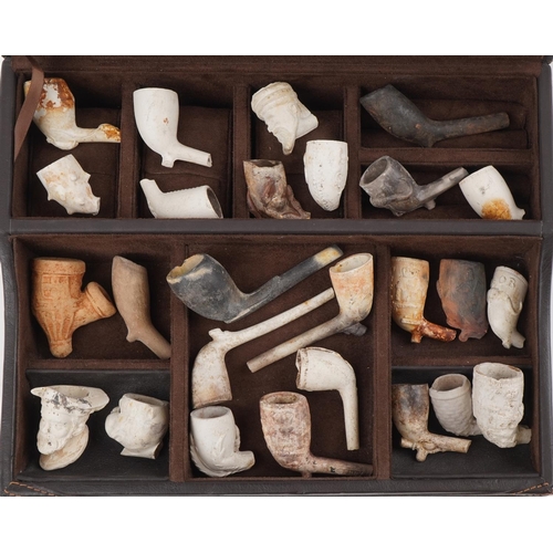 1325 - Collection of antique clay or pottery tobacco smoking pipes and bowls including examples in the form... 