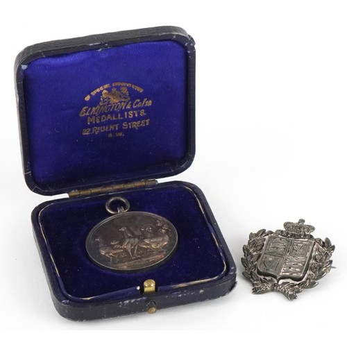 2359 - 1887 silver jubilee pin badge and a silver jewel cast with poultry housed in a fitted case, total 14... 