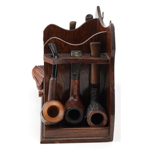 1267 - Twenty tobacco smoking pipes, some briar, arranged in three pipe racks including Dr Plumb and Kay Wo... 