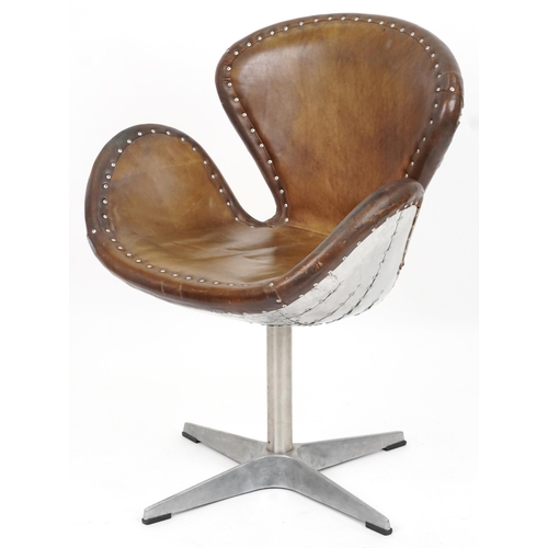 2119 - Timothy Oulton aviation interest Devon Spitfire swivel chair with brown leather upholstery, 90cm hig... 