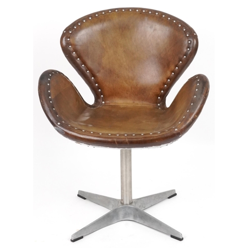 2119 - Timothy Oulton aviation interest Devon Spitfire swivel chair with brown leather upholstery, 90cm hig... 