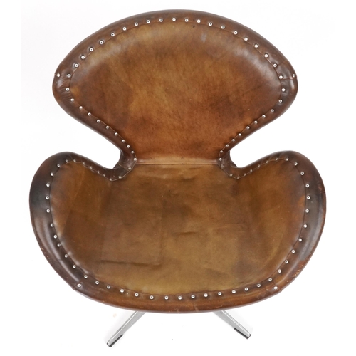 2119 - Timothy Oulton aviation interest Devon Spitfire swivel chair with brown leather upholstery, 90cm hig... 