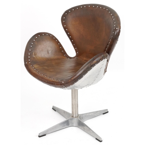 2041 - Timothy Oulton aviation interest Devon Spitfire swivel chair with brown leather upholstery, 90cm hig... 