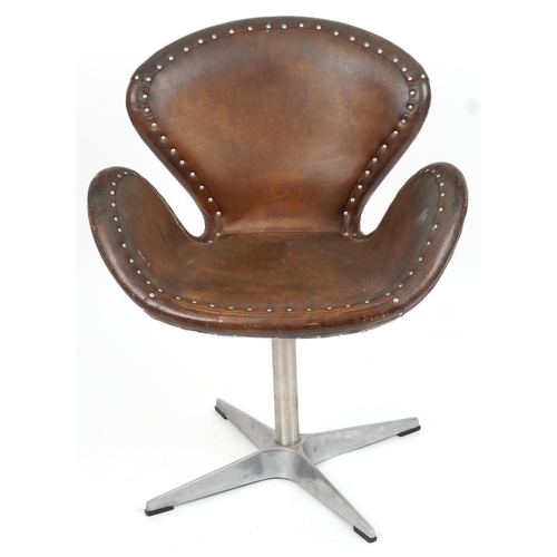 2041 - Timothy Oulton aviation interest Devon Spitfire swivel chair with brown leather upholstery, 90cm hig... 