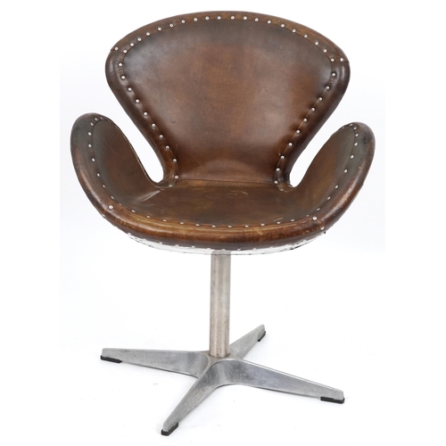 2042 - Timothy Oulton aviation interest Devon Spitfire swivel chair with brown leather upholstery, 90cm hig... 