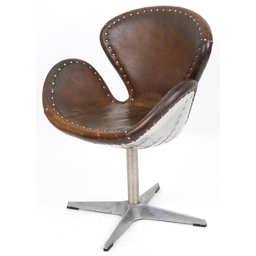 2042 - Timothy Oulton aviation interest Devon Spitfire swivel chair with brown leather upholstery, 90cm hig... 