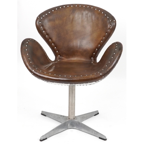 2117 - Timothy Oulton aviation interest Devon Spitfire swivel chair with brown leather upholstery, 90cm hig... 