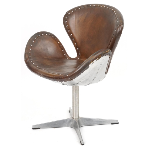 2116 - Timothy Oulton aviation interest Devon Spitfire swivel chair with brown leather upholstery, 90cm hig... 