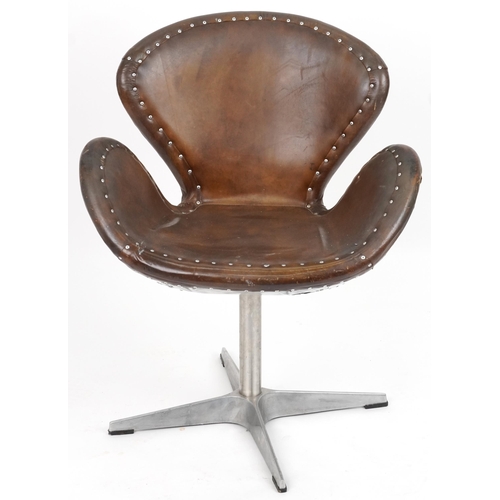 2116 - Timothy Oulton aviation interest Devon Spitfire swivel chair with brown leather upholstery, 90cm hig... 