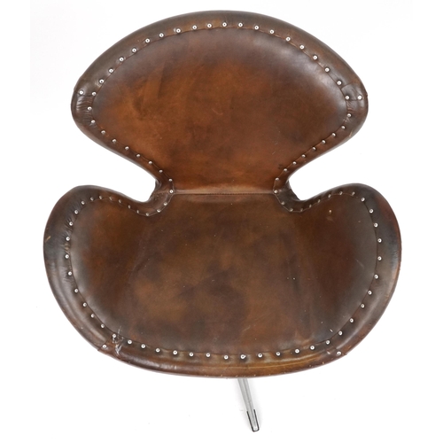 2116 - Timothy Oulton aviation interest Devon Spitfire swivel chair with brown leather upholstery, 90cm hig... 