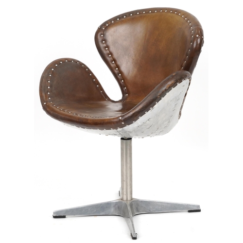 2118 - Timothy Oulton aviation interest Devon Spitfire swivel chair with brown leather upholstery, 90cm hig... 