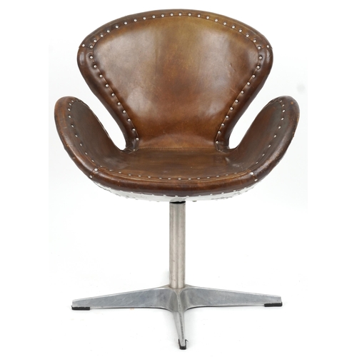 2118 - Timothy Oulton aviation interest Devon Spitfire swivel chair with brown leather upholstery, 90cm hig... 