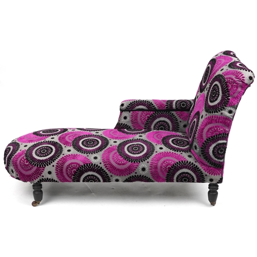 2059 - Chaise longue with contemporary pink, black and silver flower head design upholstery on turned eboni... 