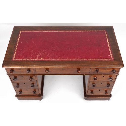 2045 - Victorian mahogany twin pedestal desk with tooled leather insert fitted with an arrangement of nine ... 