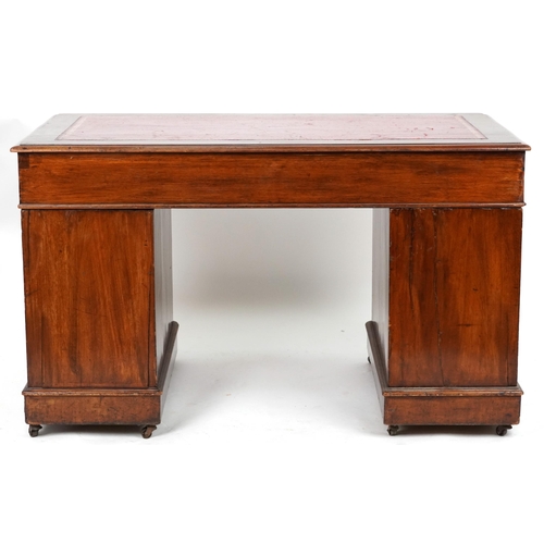 2045 - Victorian mahogany twin pedestal desk with tooled leather insert fitted with an arrangement of nine ... 