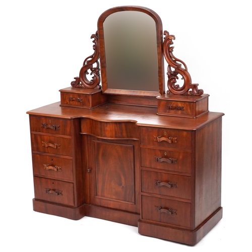 2032 - Ornate Victorian mahogany dressing chest with swing mirror fitted with an arrangement of ten drawers... 