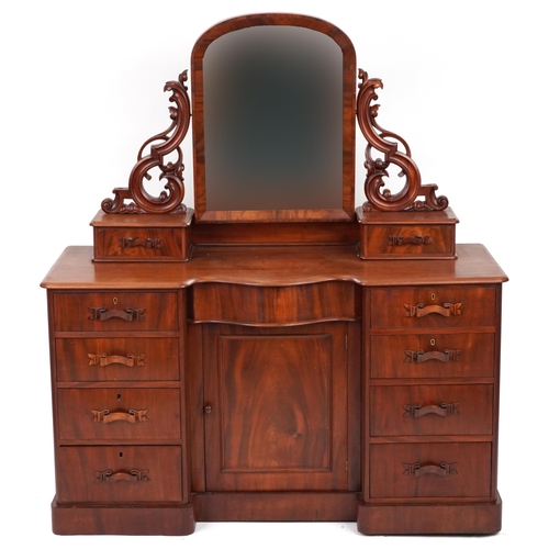 2032 - Ornate Victorian mahogany dressing chest with swing mirror fitted with an arrangement of ten drawers... 