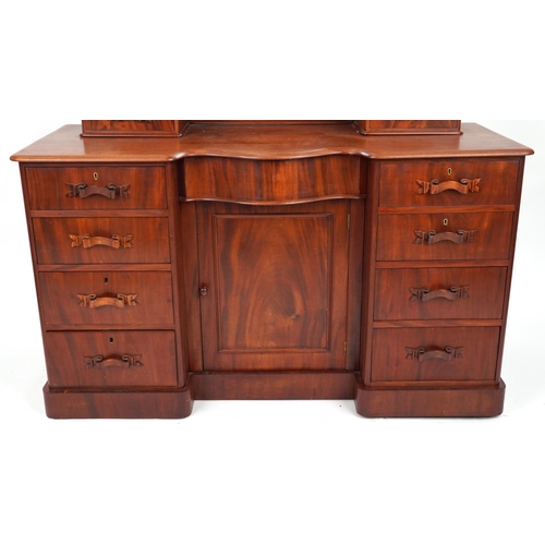 2032 - Ornate Victorian mahogany dressing chest with swing mirror fitted with an arrangement of ten drawers... 