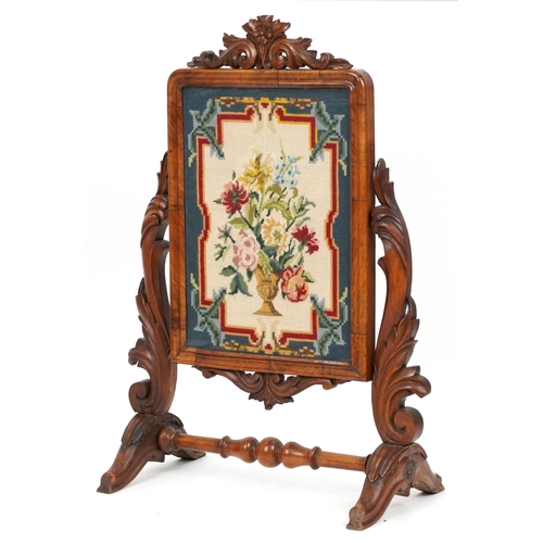 2126 - Victorian walnut screen carved with foliage housing a needlepoint tapestry of flowers in an urn, 99c... 