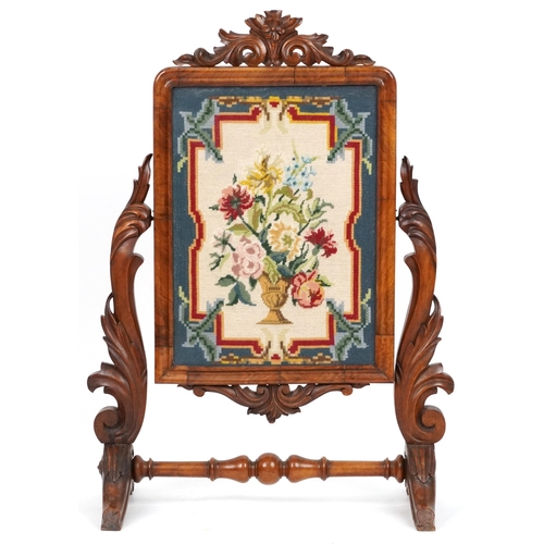 2126 - Victorian walnut screen carved with foliage housing a needlepoint tapestry of flowers in an urn, 99c... 