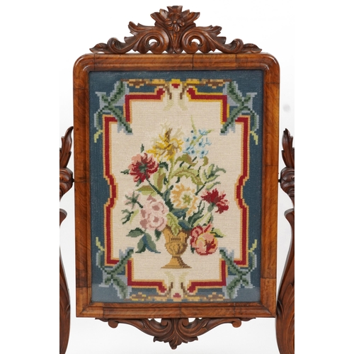 2126 - Victorian walnut screen carved with foliage housing a needlepoint tapestry of flowers in an urn, 99c... 