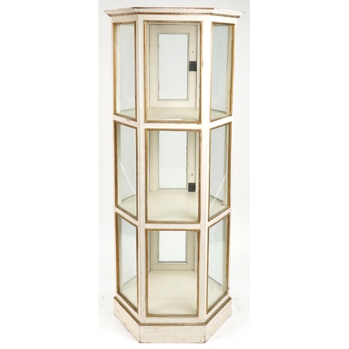 2058 - French style cream and gilt painted three tier hexagonal display cabinet with brass mounts, 180.5cm ... 