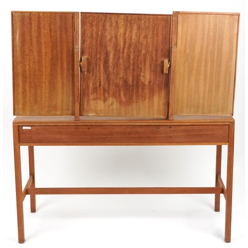 2066 - Loughborough, mid century teak three drawer dressing table with triple aspect folding mirror and bra... 