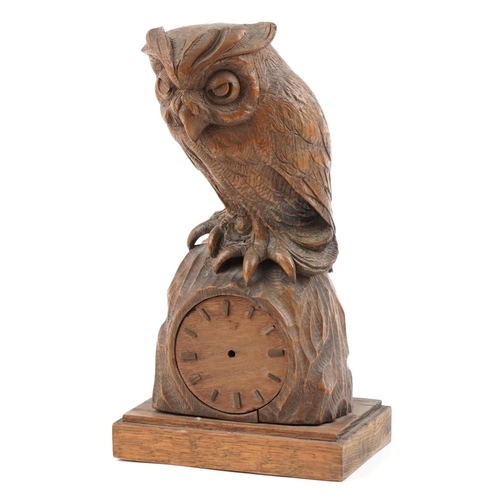 180 - German carved Black Forest hardwood clock case surmounted with an owl, 31cm high