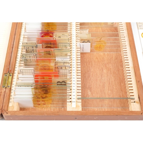 360 - Collection of scientific microscopic prepared glass slides arranged in two fitted case including zoo... 