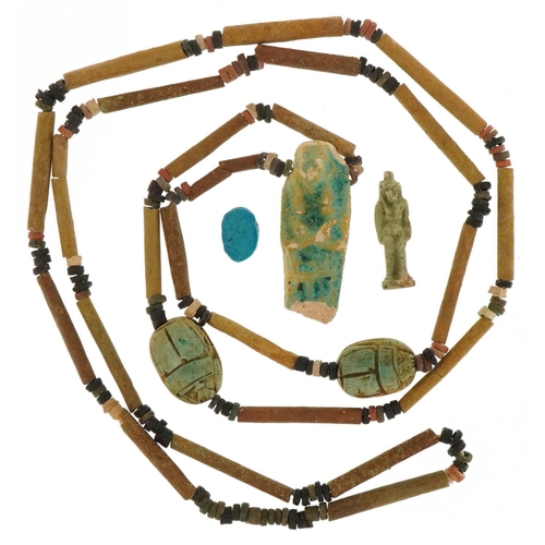 420 - Ancient Egyptian artifacts including faience bead necklace with shabti and scarab beetles and an amu... 