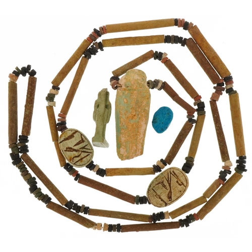 420 - Ancient Egyptian artifacts including faience bead necklace with shabti and scarab beetles and an amu... 