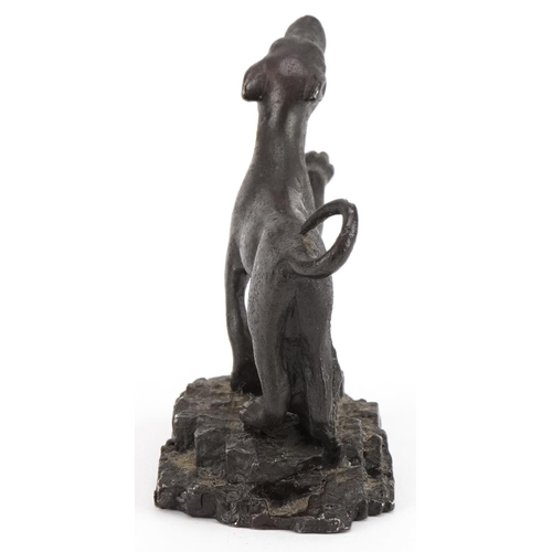 422 - Antique patinated bronze dog on later base, probably Roman, 5.5cm in length