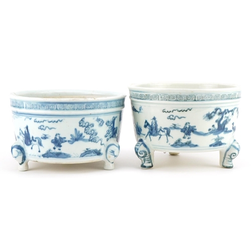 645 - Two Chinese blue and white porcelain tripod censers decorated with figures in landscapes, each 19cm ... 