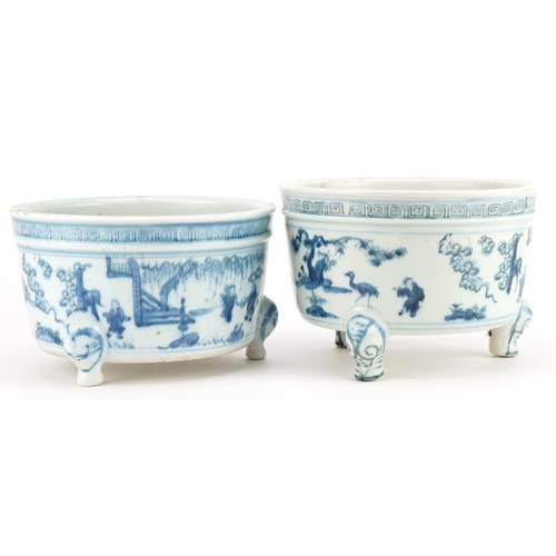 645 - Two Chinese blue and white porcelain tripod censers decorated with figures in landscapes, each 19cm ... 