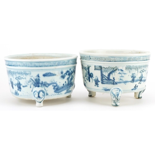 645 - Two Chinese blue and white porcelain tripod censers decorated with figures in landscapes, each 19cm ... 