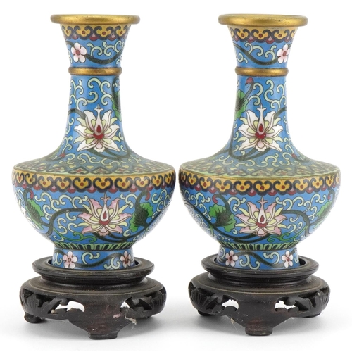 530 - Pair of Chinese cloisonne vases raised on hardwood stands enamelled with flowers amongst scrolling f... 