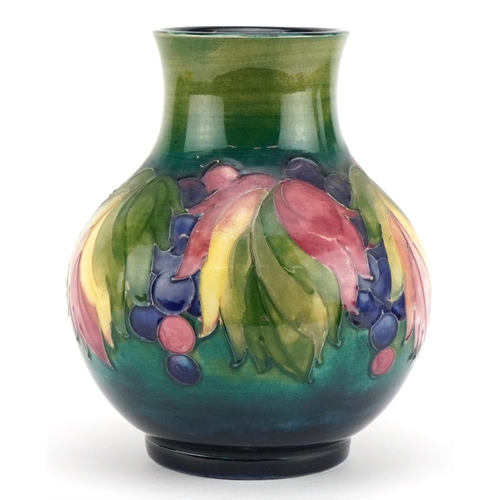 11 - William Moorcroft pottery vase hand painted in the Leaf and Berry pattern, painted and impressed mar... 