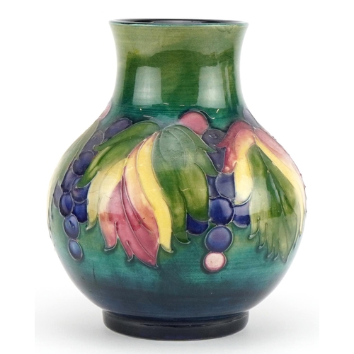 11 - William Moorcroft pottery vase hand painted in the Leaf and Berry pattern, painted and impressed mar... 