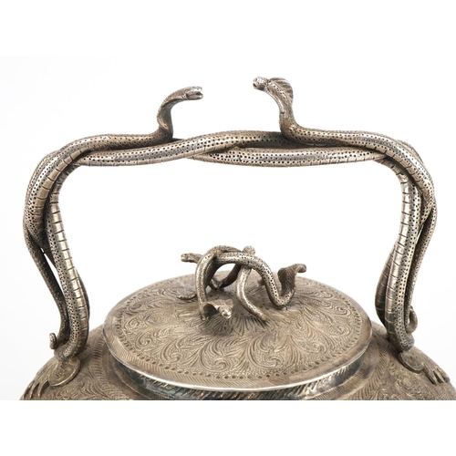 99 - Good Indian white metal teapot with serpent handles and knop finely engraved with deities amongst fl... 