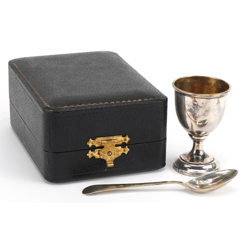 2409 - Arthur Price & Co Ltd, George VI silver christening egg cup and spoon housed in a velvet and silk li... 