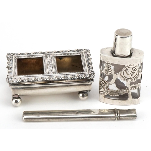 628 - Silver objects comprising a double stamp box with ball feet, letter opener and silver overlaid glass... 