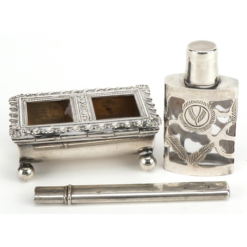 628 - Silver objects comprising a double stamp box with ball feet, letter opener and silver overlaid glass... 