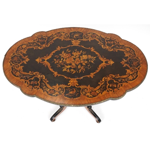 2001 - 19th century continental kingwood, ebony and marquetry inlaid tilt top centre table with shaped top ... 